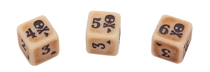 Close-up shot of antique colored dice with engraved skull and number icons