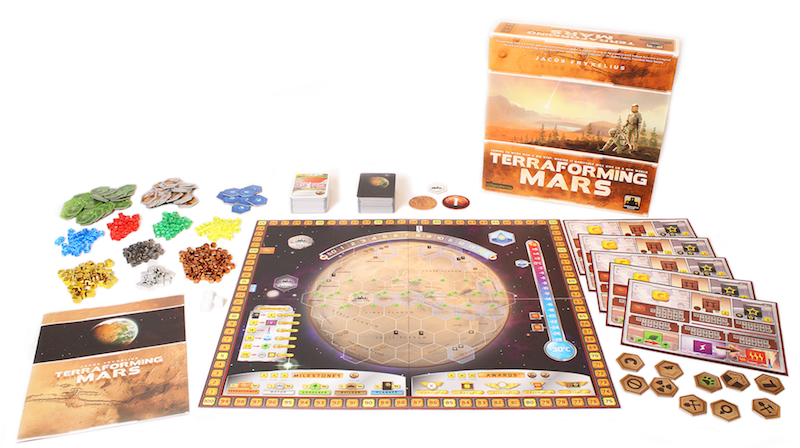 all components of Terraforming Mars game laid out, including board game box, rulebook, game tokens, player pieces, and game board