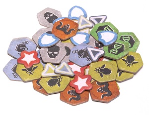 A pile of the various tokens included in the Fallout board game.