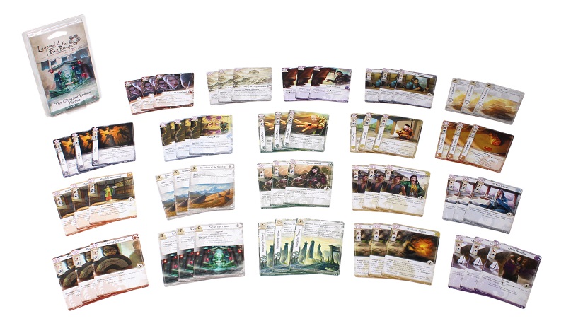 all game components laid out, including numerous sets of three cards each