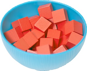 closeup of blue game piece bowl containing red cube-shaped game pieces 