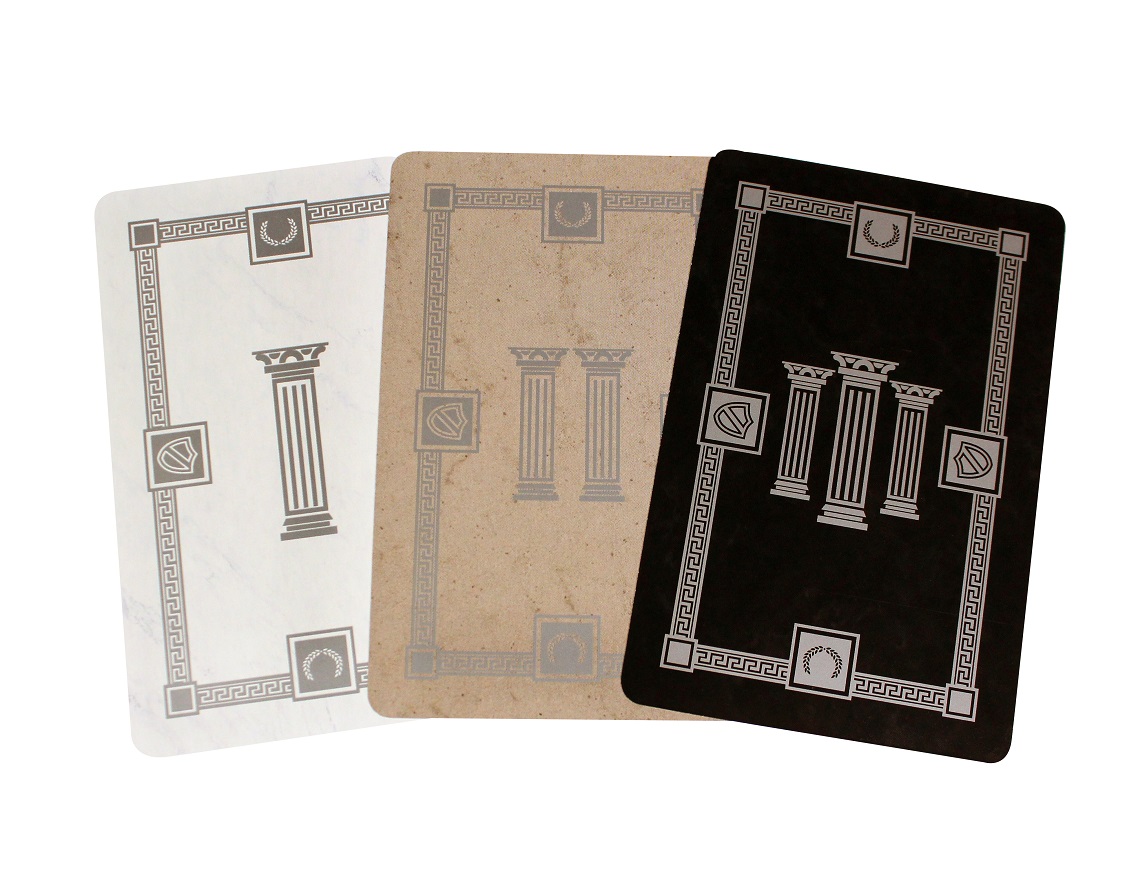 three game cards laid out, in the colors of white, gold, and black