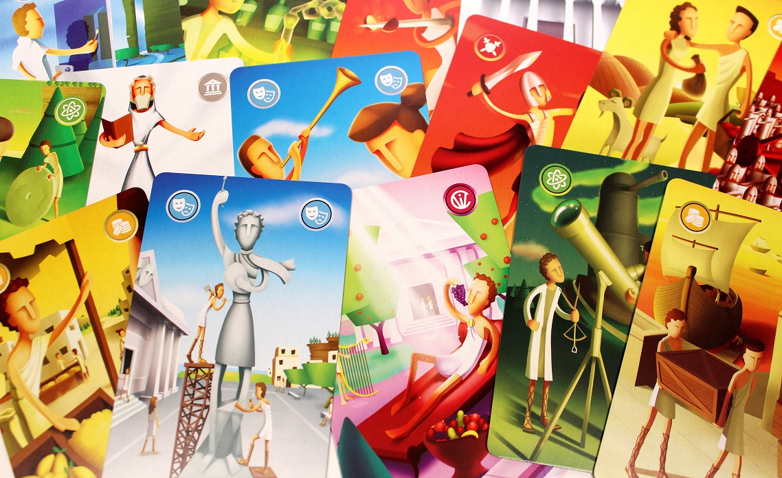 numerous game cards spread out with their colorful art showing face up