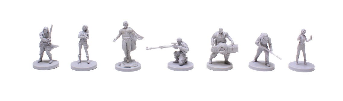 Seven unpainted plastic character miniatures displayed in a row