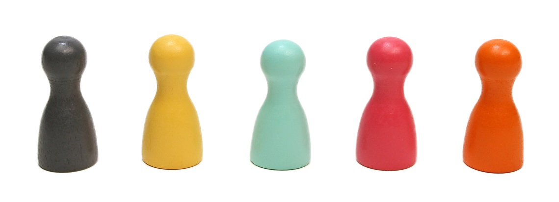 five wooden game board pieces, in the colors of black, yellow, light blue, pink, and orange