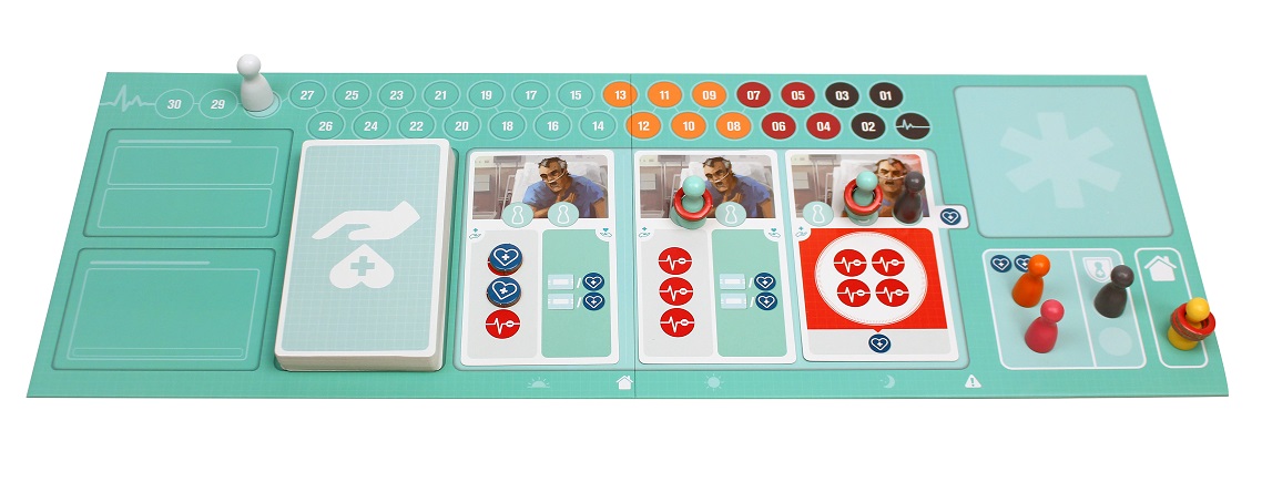 closeup of game board, with cards, game board pieces, and tokens placed upon it